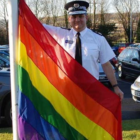 Policeman with Rainbow Flag